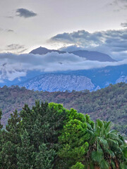 Mountains in the clouds in sunny day