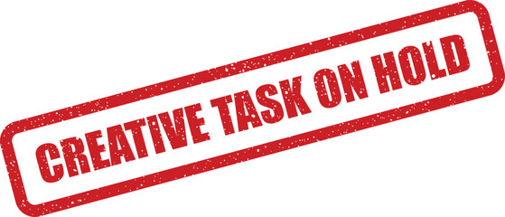 Grungy red rectangular rubber stamp displaying Creative Task On Hold message, signifying a temporary pause