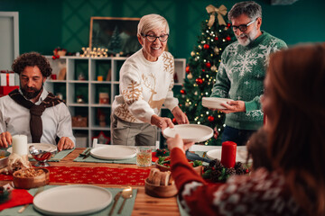 Family serving christmas dinner at home