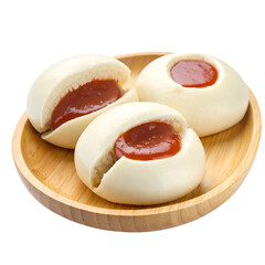 Steamed buns with red filling served on a wooden plate, against a clean background