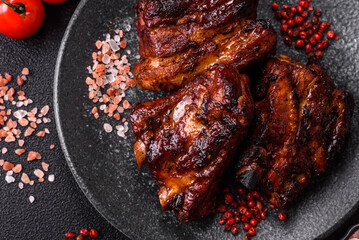 Grilled or barbecued pork ribs with sauce. Grilled ribs