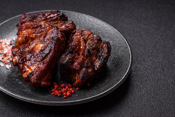 Grilled or barbecued pork ribs with sauce. Grilled ribs