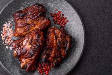 Grilled or barbecued pork ribs with sauce. Grilled ribs