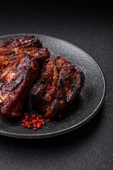 Grilled or barbecued pork ribs with sauce. Grilled ribs