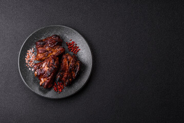 Grilled or barbecued pork ribs with sauce. Grilled ribs