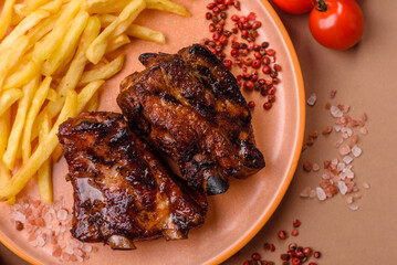 Grilled or barbecued pork ribs with sauce. Grilled ribs