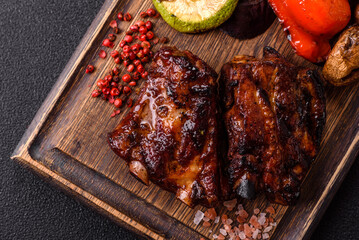 Grilled or barbecued pork ribs with sauce. Grilled ribs