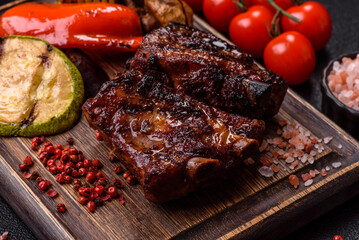 Grilled or barbecued pork ribs with sauce. Grilled ribs