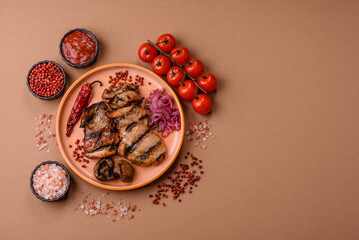 Chicken breast cooked on a grill or barbecue with sauce. Grilled chicken