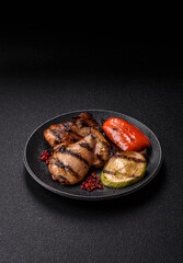 Chicken breast cooked on a grill or barbecue with sauce. Grilled chicken