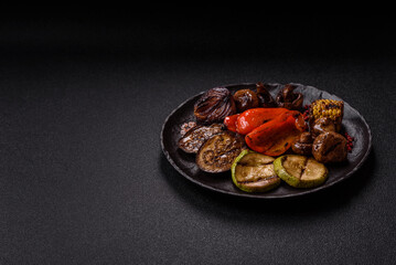 Grilled vegetables, bell peppers, mushrooms, and zucchini, a vegetarian meal. Grilled vegetables