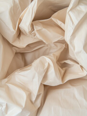 Crinkled paper texture with soft folds and subtle shadows in a neutral color 