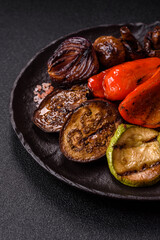 Grilled vegetables, bell peppers, mushrooms, and zucchini, a vegetarian meal. Grilled vegetables