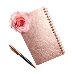 A pink rose rests on a rose-gold textured notebook with a matching pen, isolated on black