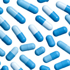 Scattered blue and white capsule pills against a solid black background, close-up view