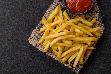 French fries cooked in oil, crispy golden chips, unhealthy food. French fries as a background