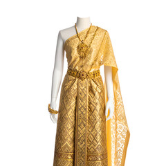 A mannequin displays a golden Thai traditional dress, ornate with jewelry