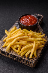 French fries cooked in oil, crispy golden chips, unhealthy food. French fries as a background