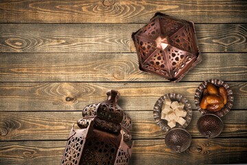 Ornamental Arabic lantern and dates on plate