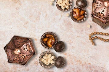 Ornamental Arabic lantern and dates on plate