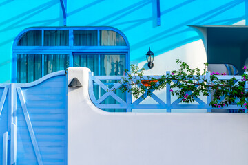 Vibrant blue architectural details with floral accents