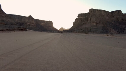 A trip to Sahara desert in Algeria. Beautiful 
african travel photo. Sandy landscapes, mountains, rocks,
dunes, and nature. Summer vacation in arab country.