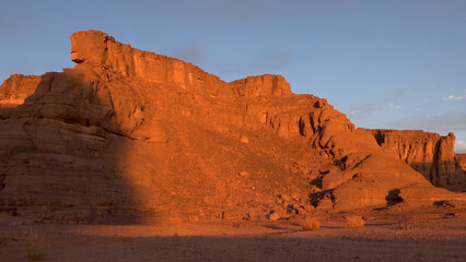 A trip to Sahara desert in Algeria. Beautiful 
african travel photo. Sandy landscapes, mountains, rocks,
dunes, and nature. Summer vacation in arab country.