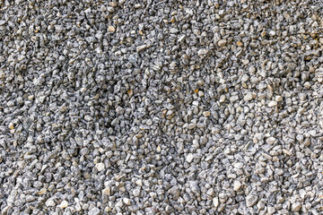 Close-up view of natural gray gravel stones in a pile