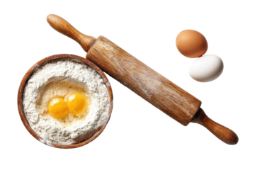 Wooden rolling pin, flour bowl with eggs