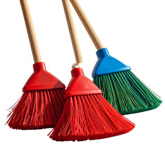 Three angled brooms with colored bristles and wooden handles against a black backdrop