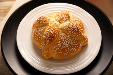Pan de Muerto. Typical Mexican sweet bread that is consumed in the season of the day of the dead. It is a main element in the altars and offerings in the festivity of the day of the dead.