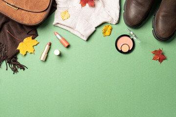 Autumn cloth and accessories at white background with copy space.