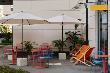 Colorful Outdoor Caf Ambiance with Umbrellas and Chairs