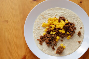 Poor mans taco. Only minced meat and corn. Concept photo.