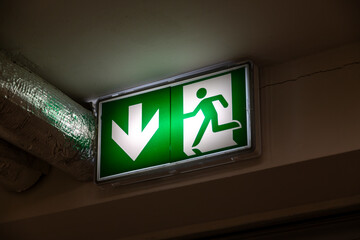 Emergency exit green light sign. 