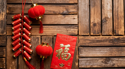 Traditional Chinese New Year Decorations Flat Lay with Red Envelope, Lanterns, and Firecrackers