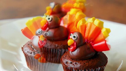 Chocolate cupcakes with a turkey decoration on top. Sweet food for fall holiday Thanksgiving - Powered by Adobe