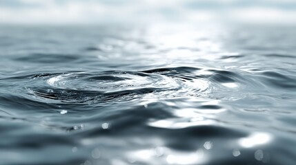Rippling water surface with soft light reflections captured in a calm environment