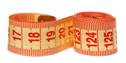 Metric measuring tape roll isolated on white background