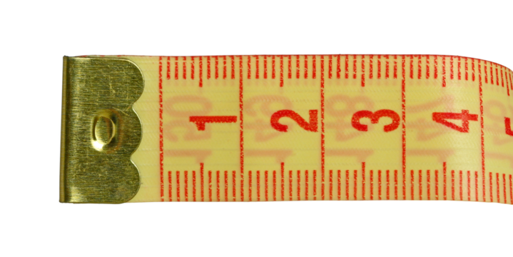 Close up metric measuring tape roll isolated on white background, macro