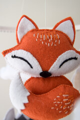 Handmade felt baby mobile with animals and stars — nursery decor