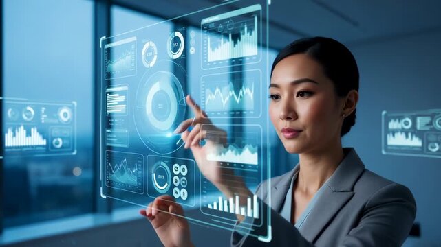 Asian businesswoman using a futuristic holographic touch screen. Professional analyzing data charts and graphs on a virtual interface. Business intelligence and innovation concept - Powered by Adobe