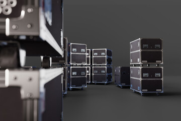Music, Entertainment, Event. Black flight cases with metal edges and wheels used for transporting stage equipment and audio gear in concert production.