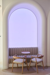 An Elegant and Modern Seating Area Enhanced with Soft Ambient Lighting and Decor Elements