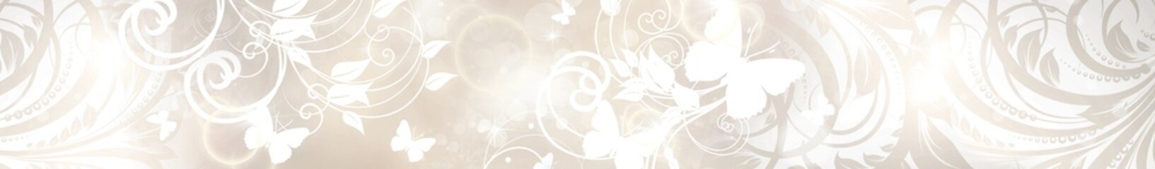 Soft beige background with white floral swirls and butterflies in ornamental decorative design with gentle glowing light