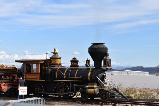 Vintage Steam Locomotive in Desert Landscape