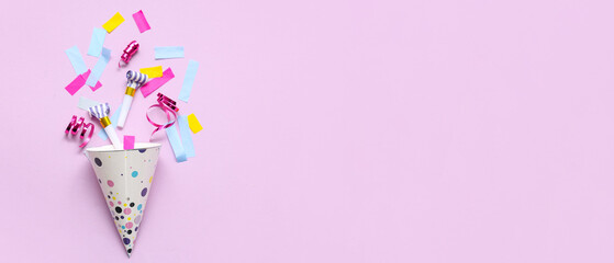 Party hat with whistles and confetti on lilac background