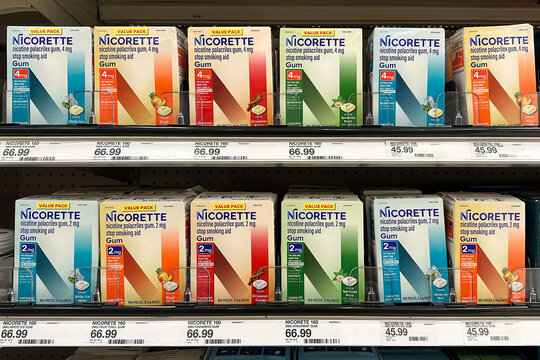 Novi, Michigan, US - 5 Oct 2025 : A full, well-stocked retail shelf display featuring two rows of Nicorette nicotine polacrilex gum in various flavors and dosages at Target retail store