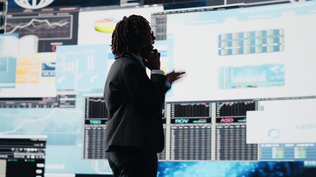 Manager sending business market graphs to shareholders using mobile phone, doing brainstorming. Businesswoman texting financial reports and data charts to business partners using smartphone, camera B - Powered by Adobe