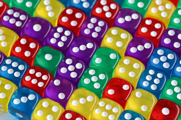 Many colorful game dices as background
